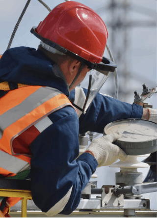 A field technician performing maintenance on an equipment