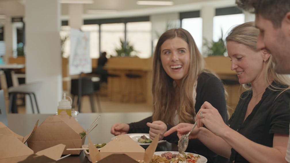 coworkers eating lunch together