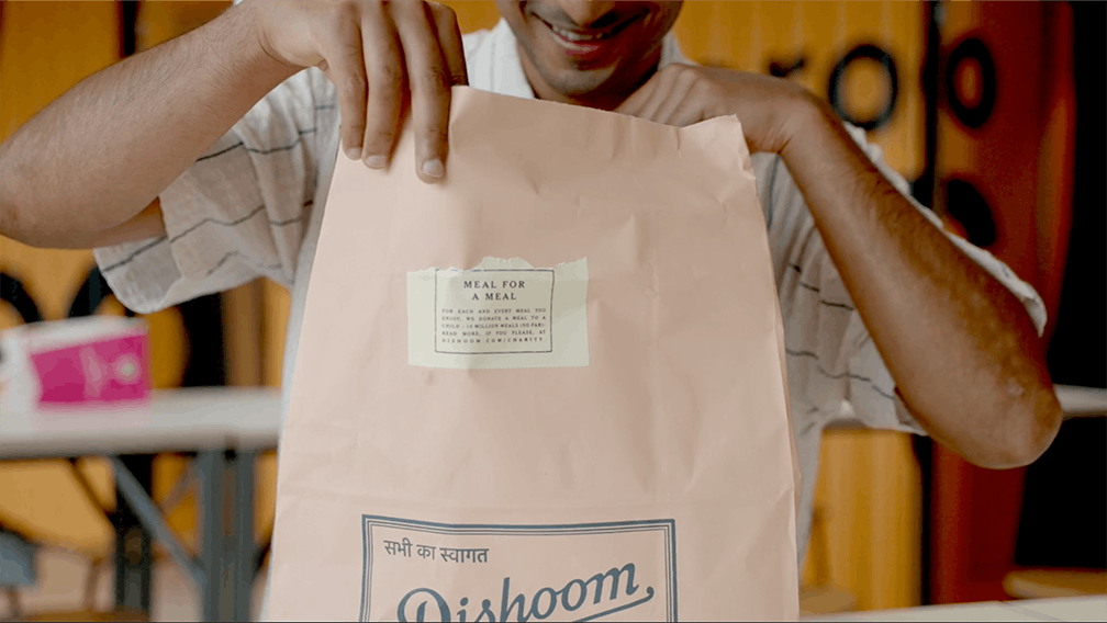 Employee opening his Deliveroo delivery