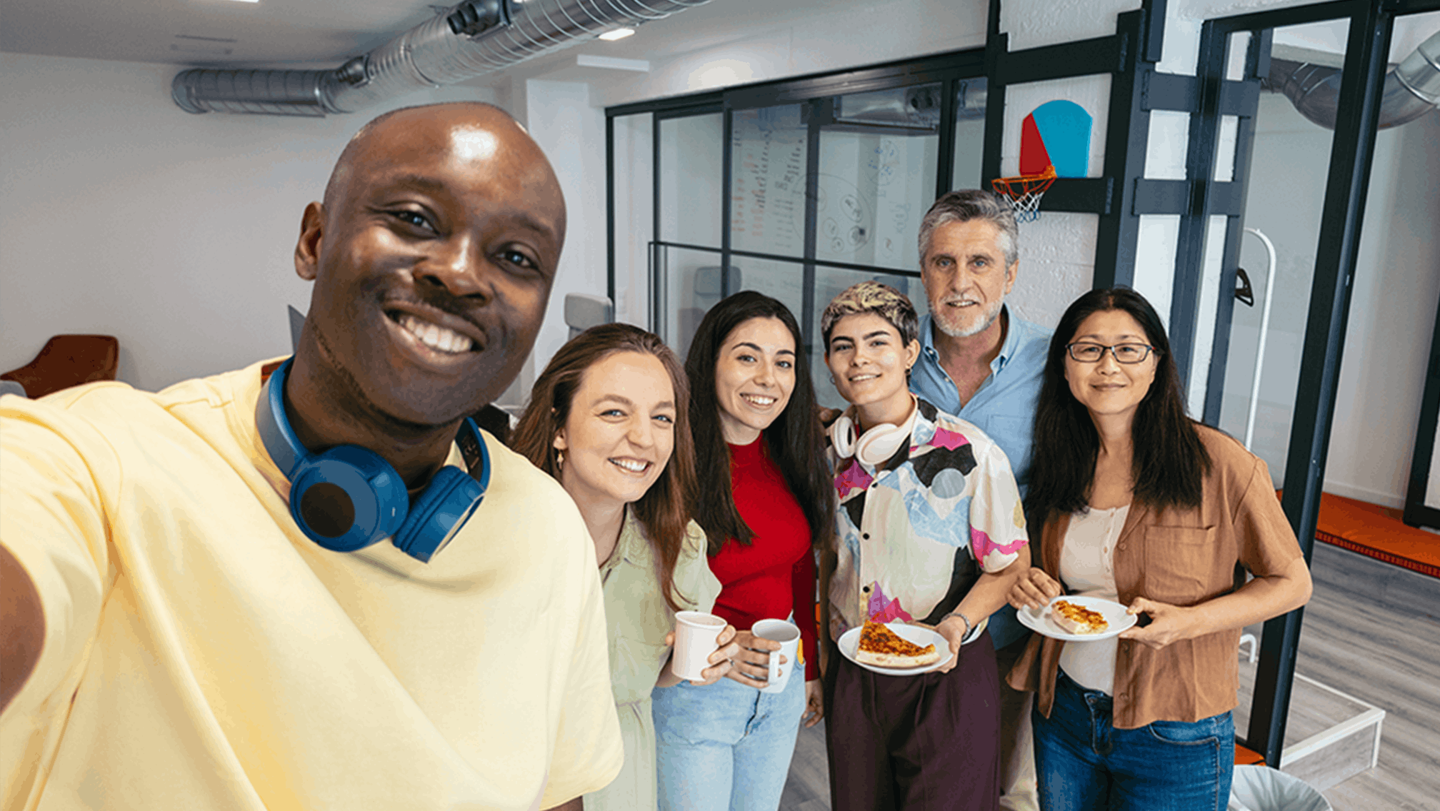 A group of coworkers taking a selfie together