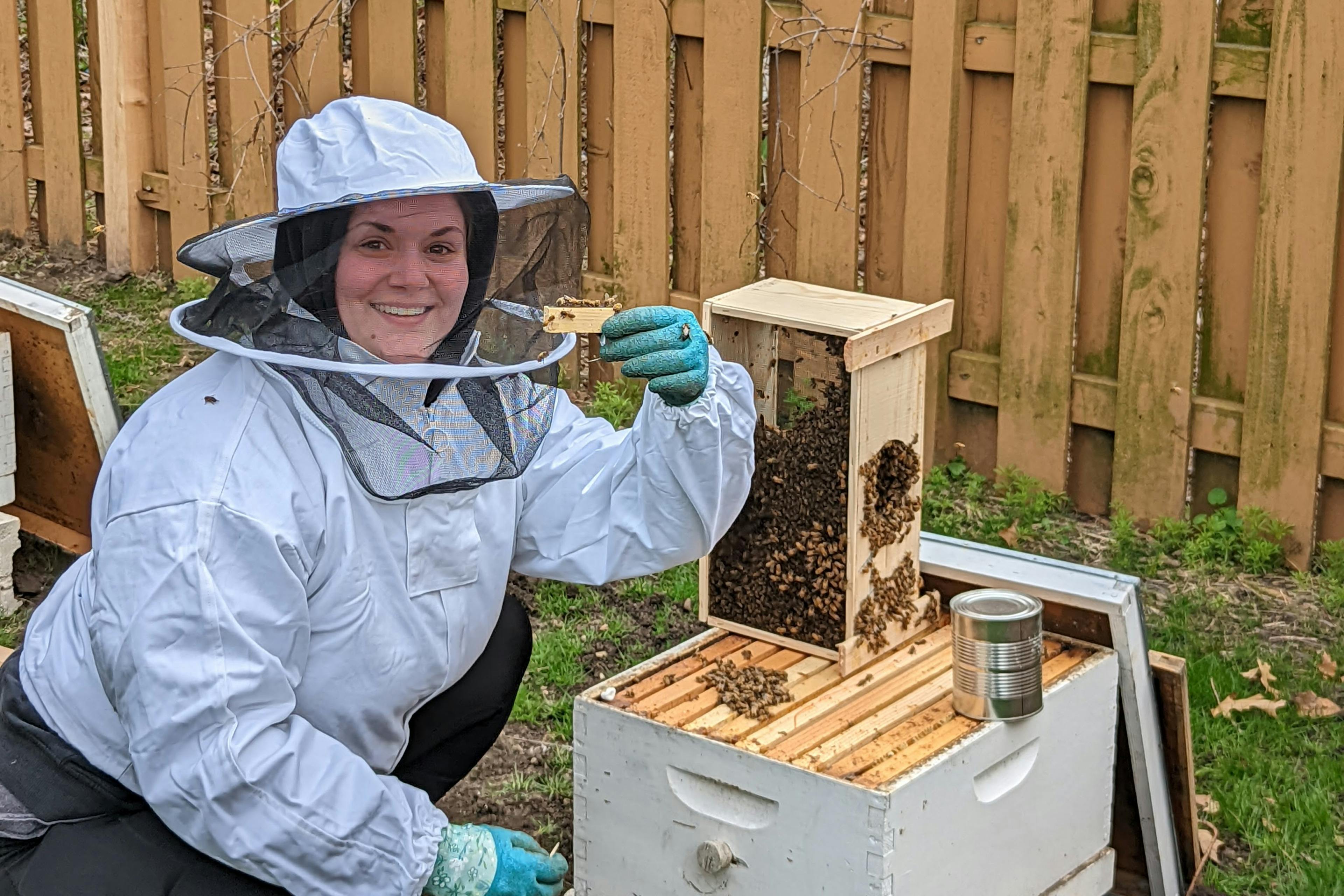 Beekeeper Maggie tending her bees