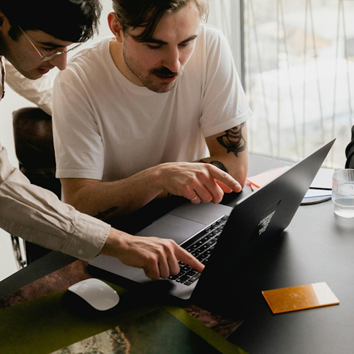 Two men discussing data.