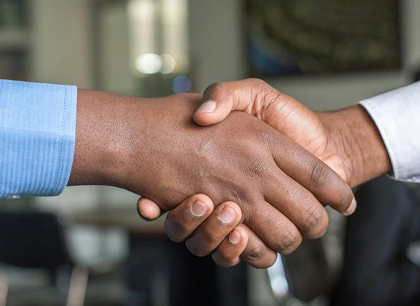 Close up of a hand shake.