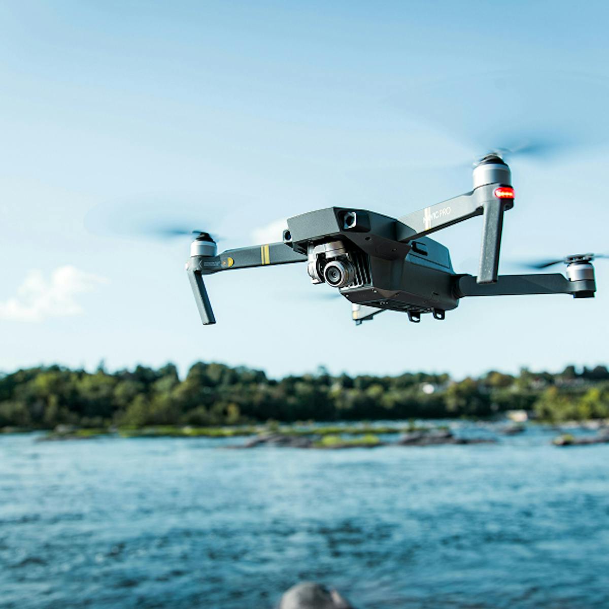 Drone flying over water.