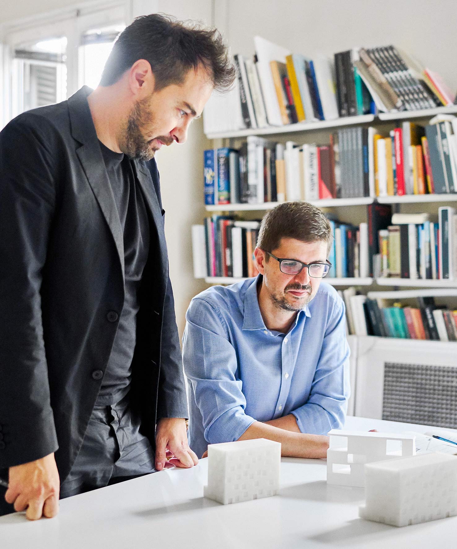 Image of the Barozzi Veiga team working at a desk
