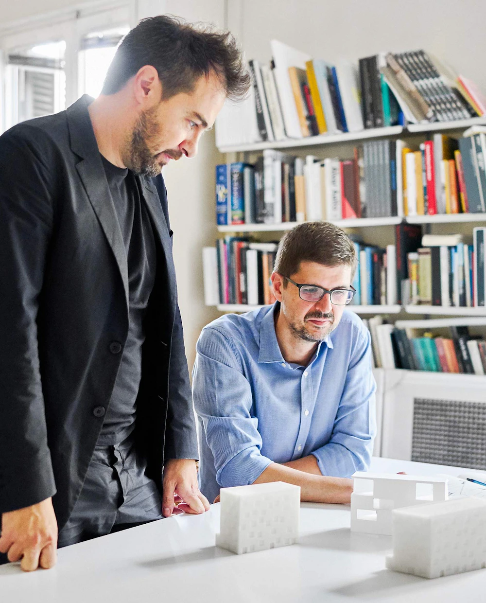 Image of the Barozzi Veiga team working at a desk