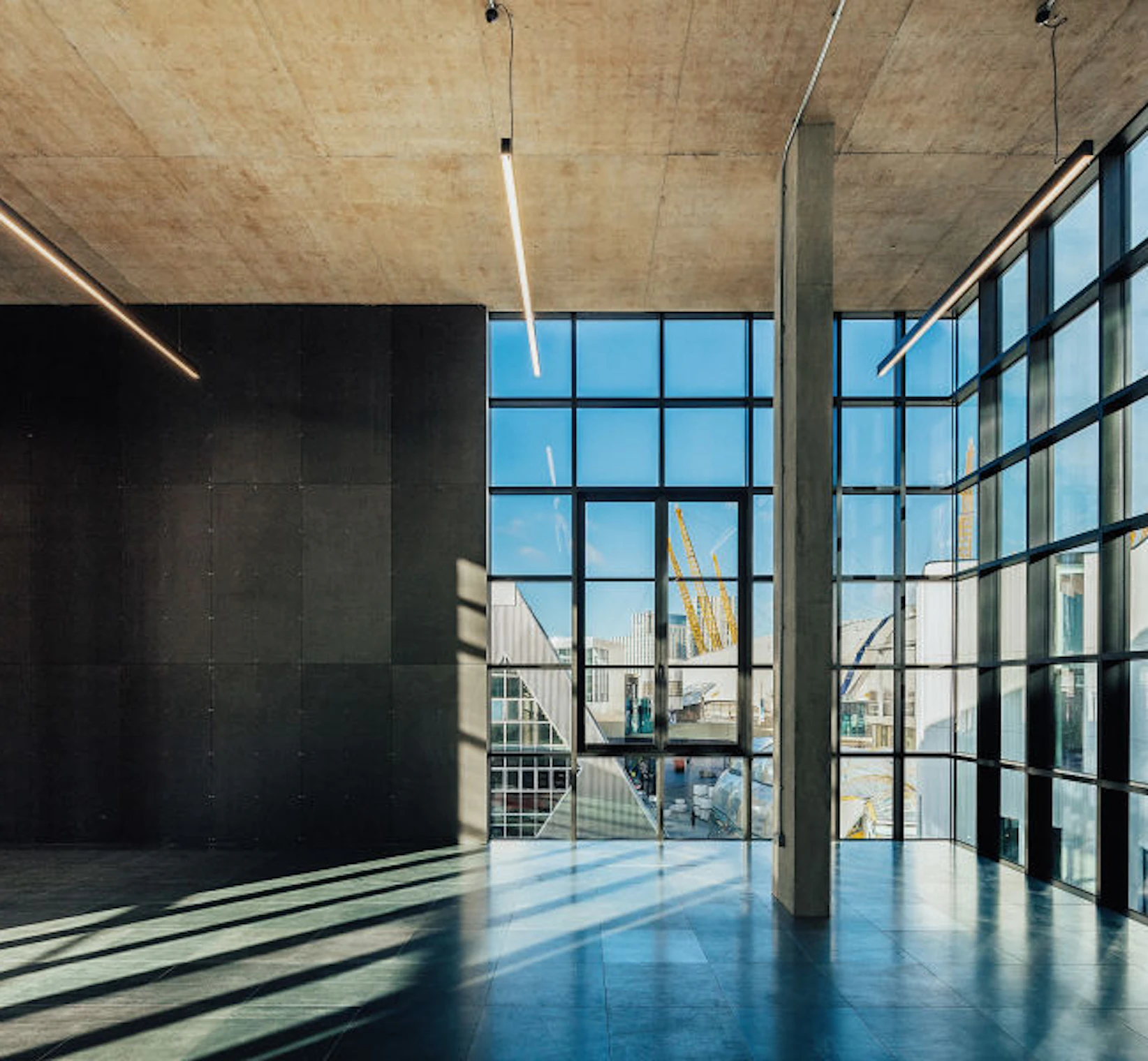Image of a building interior, with a view out of a large window