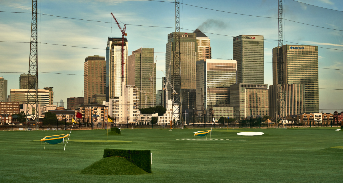Driving range in London, with views of Canary Wharf
