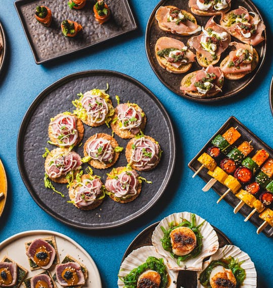 selection of canapes on a blue table