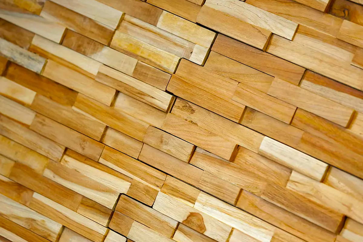 Close-up of bespoke and charming secret pivot door and matching wall surface Deuren. The door and surrounding wall surfaces are finished in stacked timber blocks, creating texture and character.