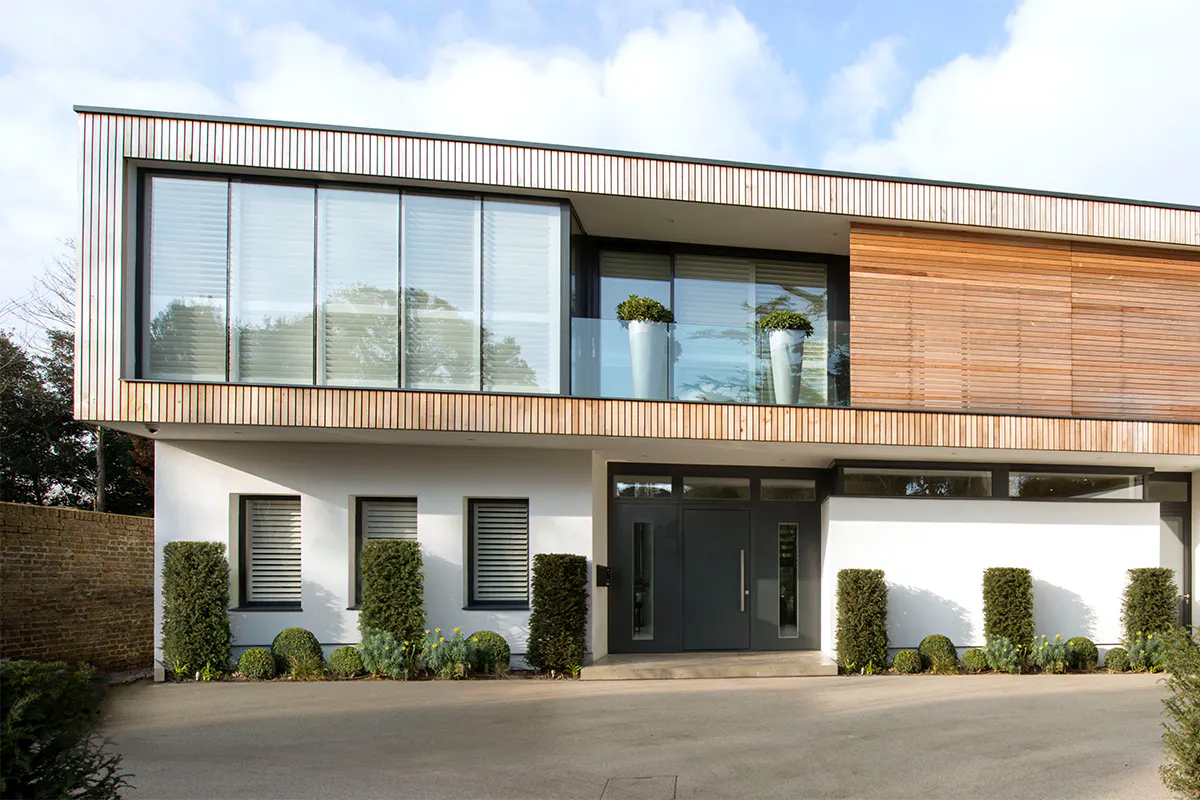 Luxurious, modern house featuring a modern entrance door by Deuren - Pianura 2 is a slab style with an anthracite paint finish