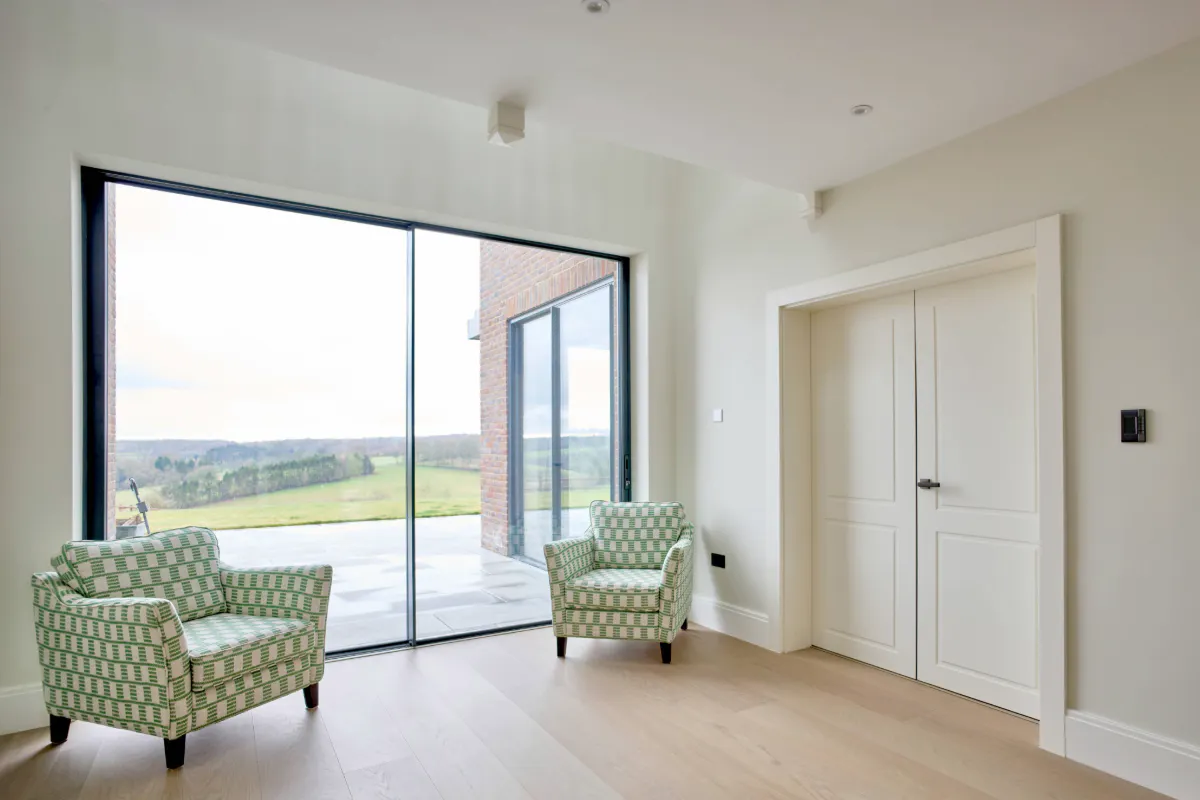 A set of Deuren double doors in Victorian style and painted white.