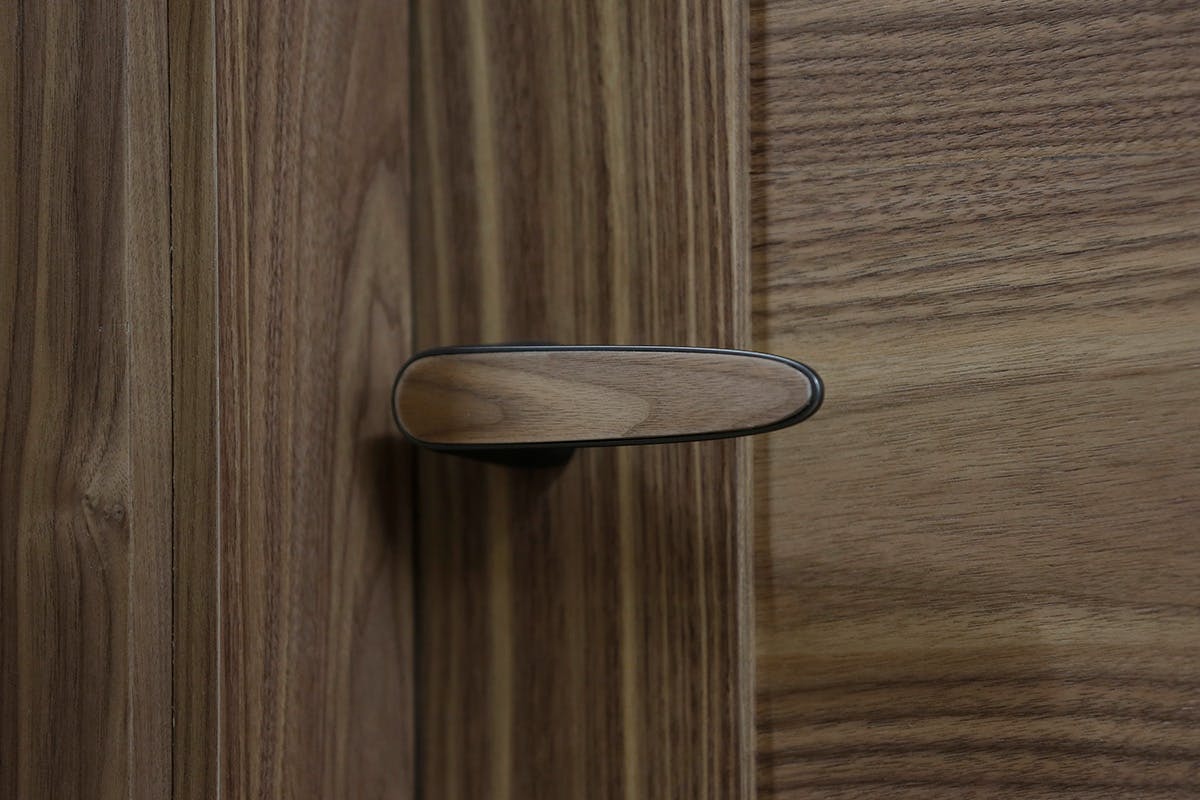 Door handle with a timber veneer finish