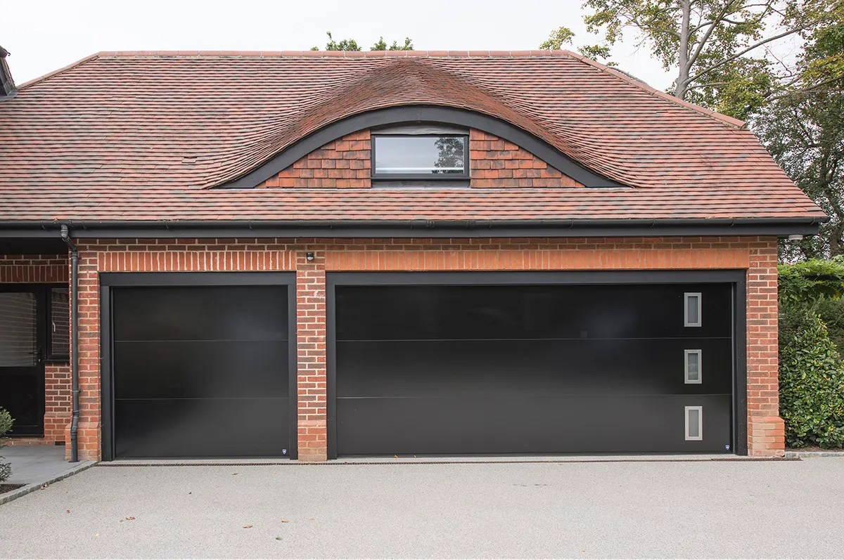 Bespoke glossy black garage doors with windows