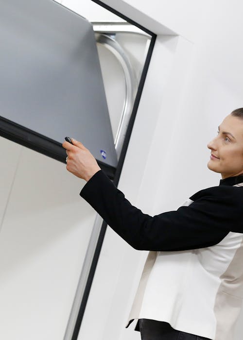 woman installing bespoke garage door