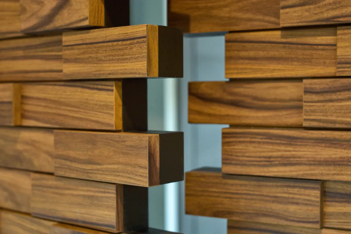 Close up of bespoke stacked timber-block door leaf cross section.