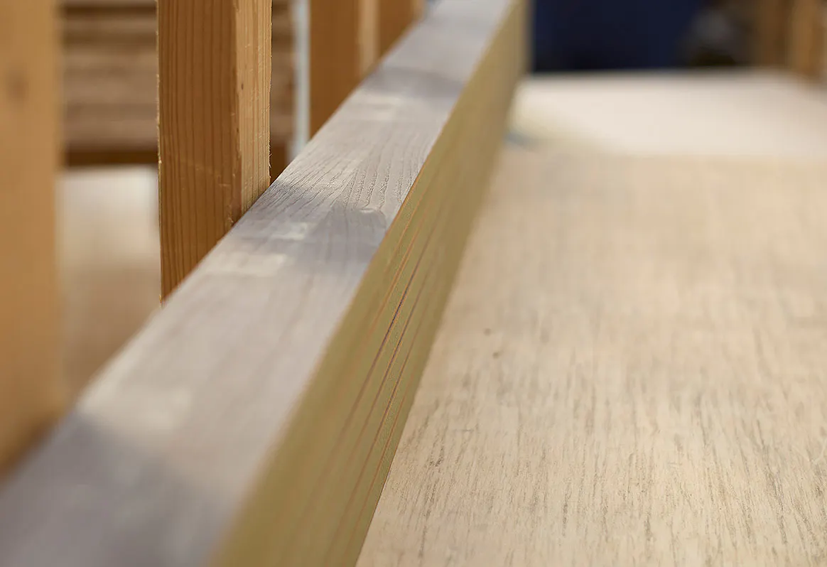 Close-up of a thick wooden beam.