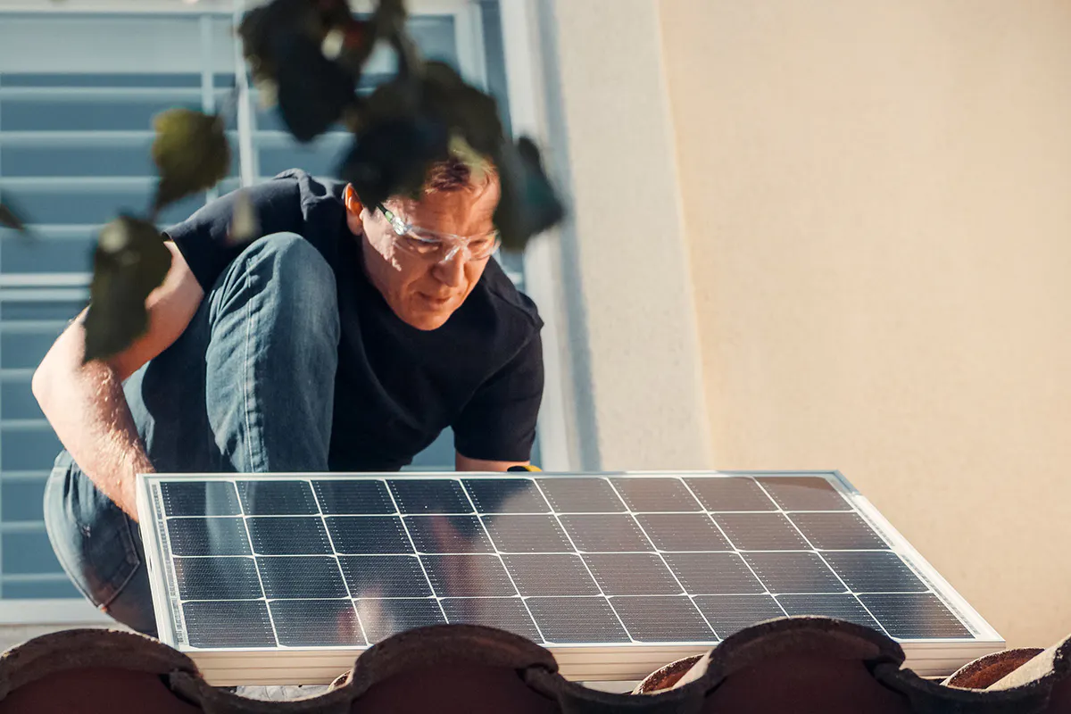 Technicial assessing soalr panels.