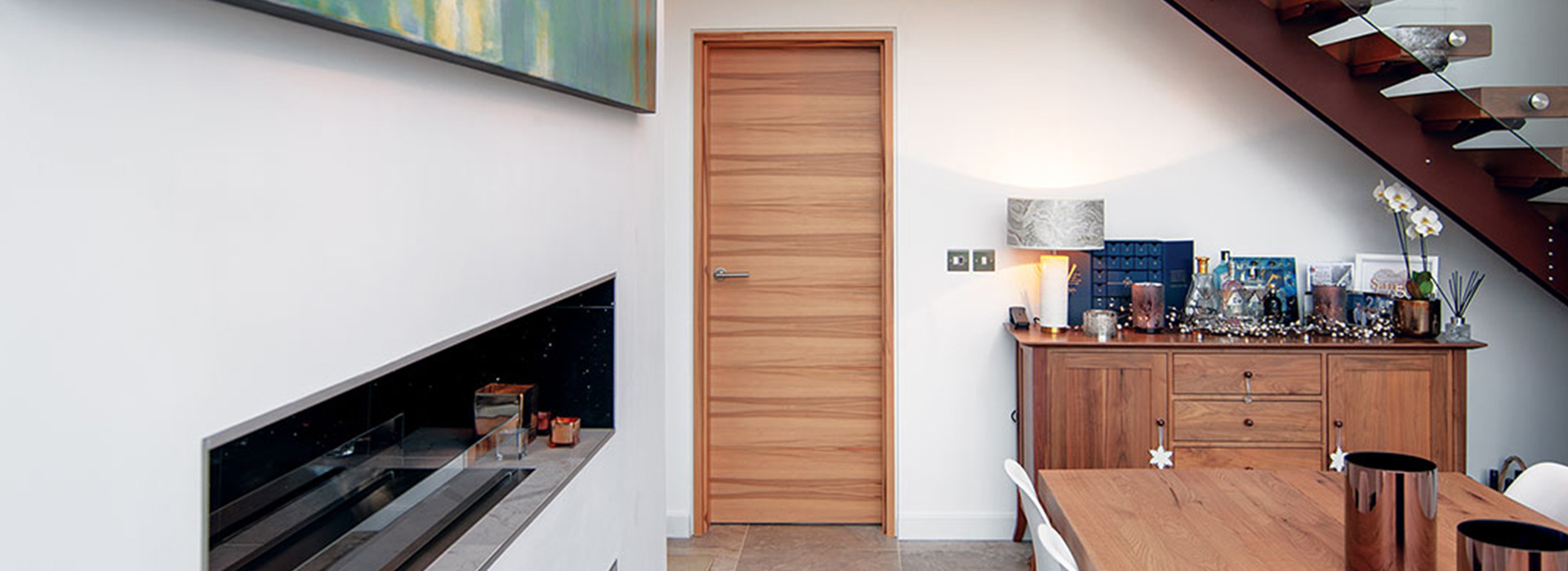 A light wooden single leaf hinged door.