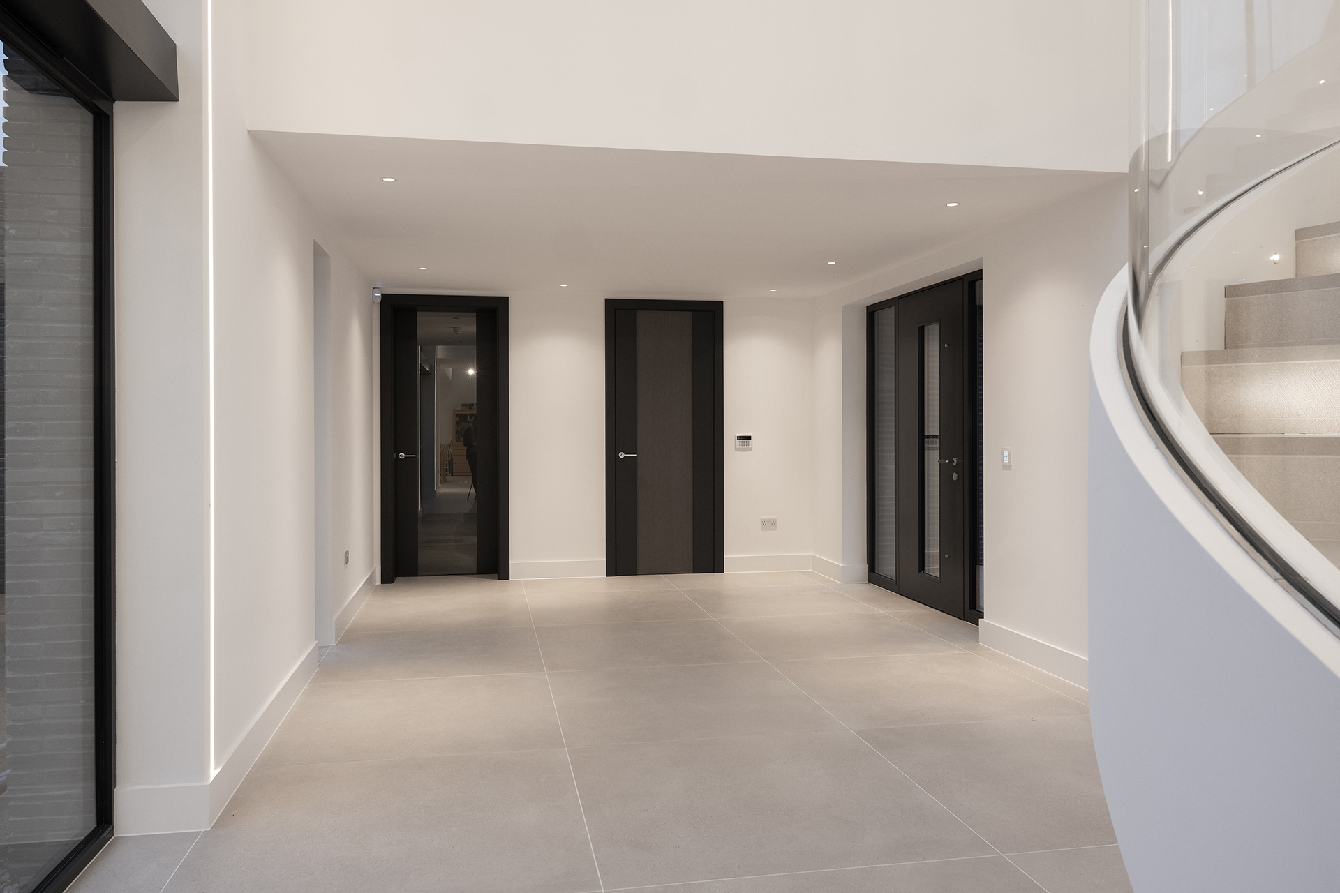 (Left) Internal Linea Door, Dark Grey Paint Finish & Glazed Centre | (Centre) Internal Linea Door Smoked Oak Vertical Veneer Centre & Dark Grey Painted Sides | (Right) External Vista Dark Grey Paint Finish with Glazed Centre