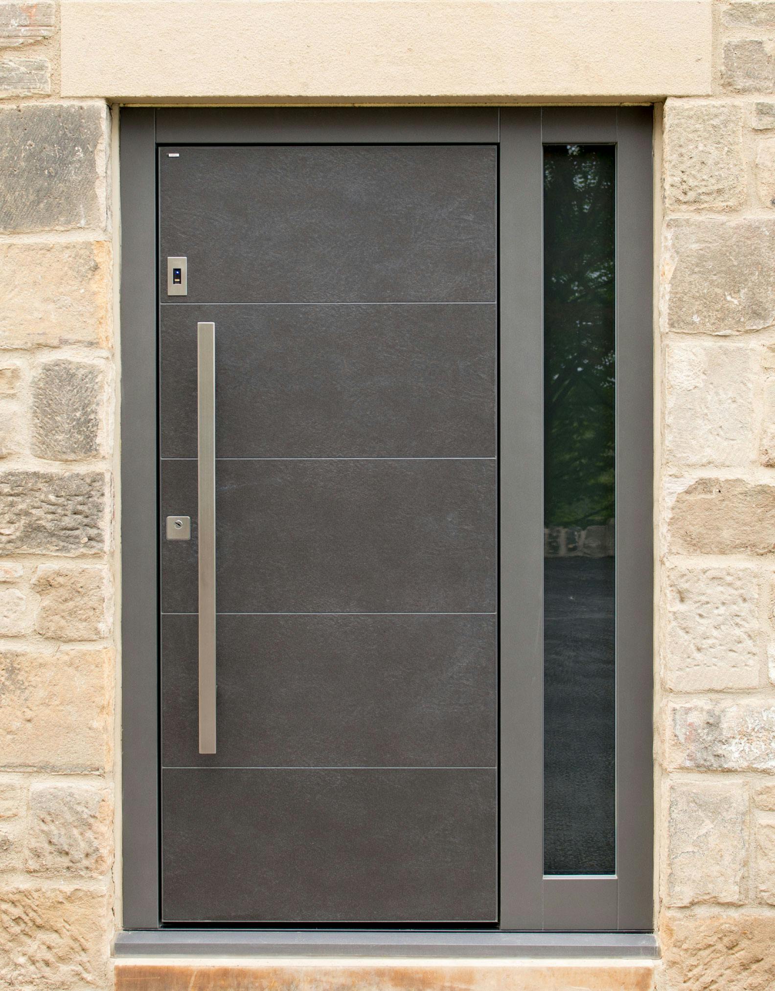 Luxury front door by Deuren - Pianura 1, in grey slate-look finish with long, square, bar handle.