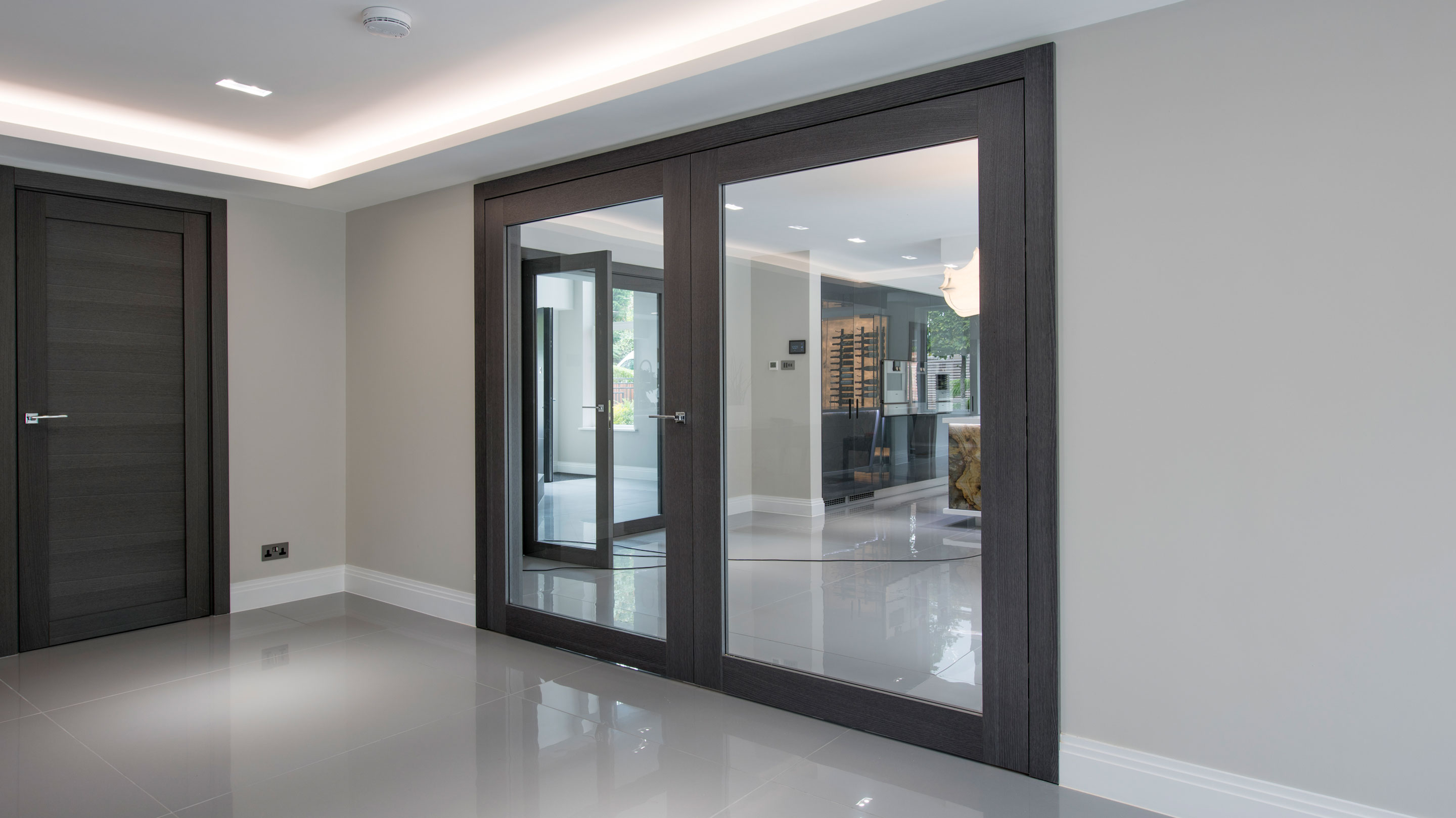 Grey oak double leaf internal doors - Gio glass by Deuren