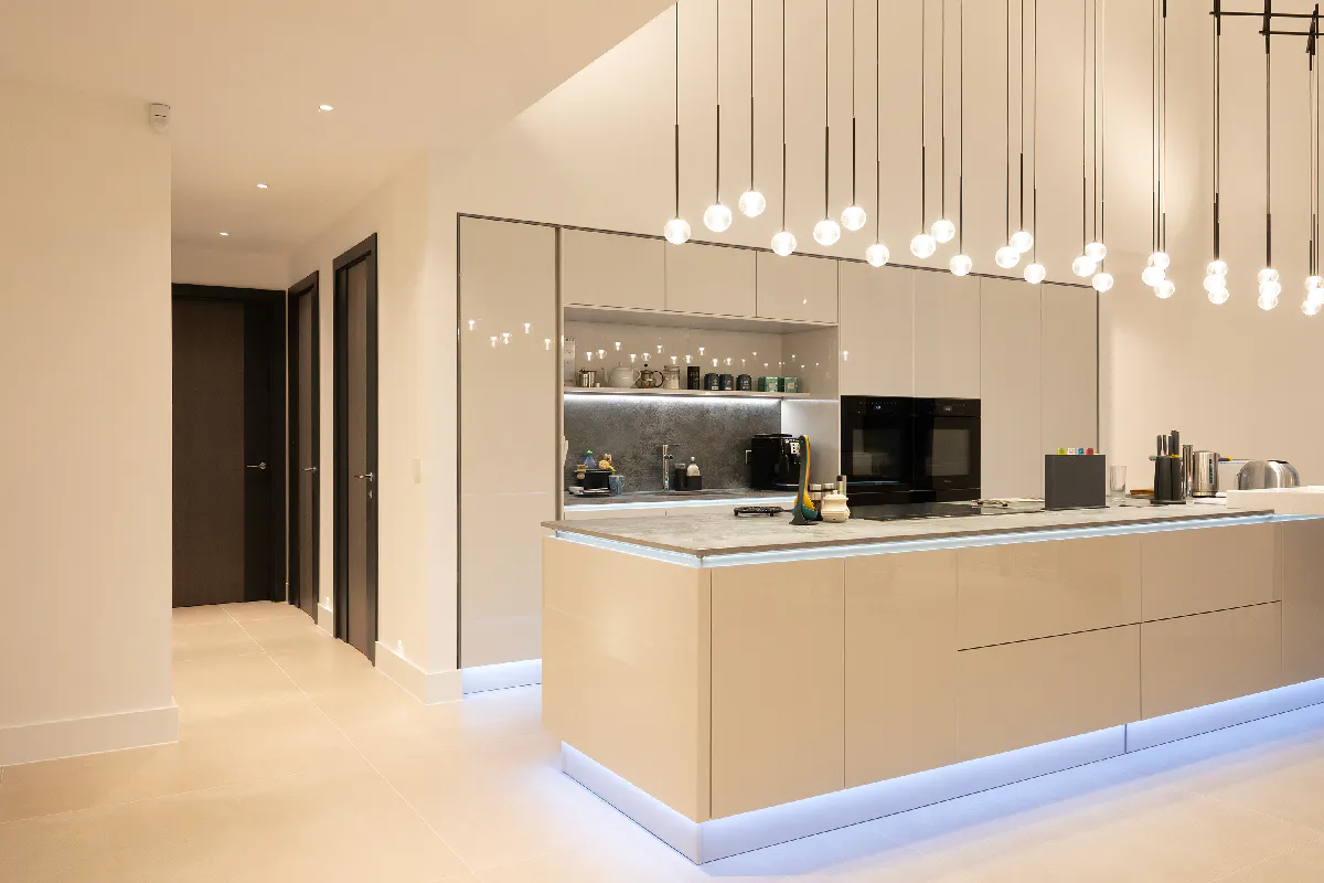 A highly sophisticated kitchen and side corridor with three Deuren made-to-measure internal door sets - - Linea style and dark grey painted finish.