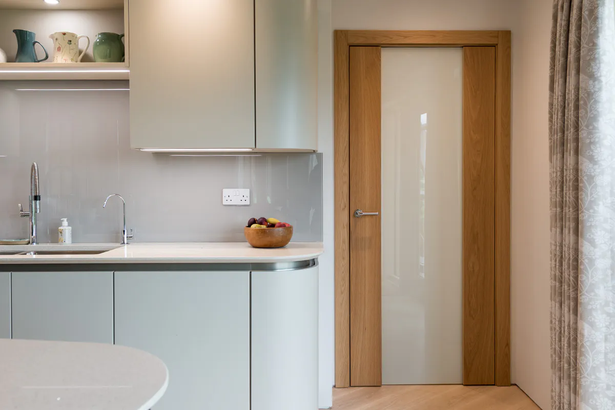 slick and modern kitchen feautring a glass door by Deuren - Trem Glazed in natural oak