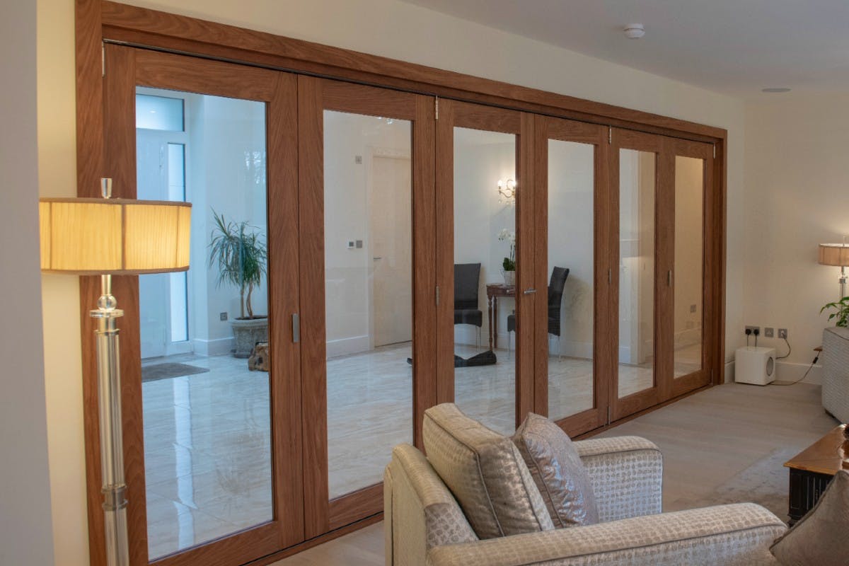internal bi-folding doors with 6 glazed door leaves - Gio Glazed in oak finish