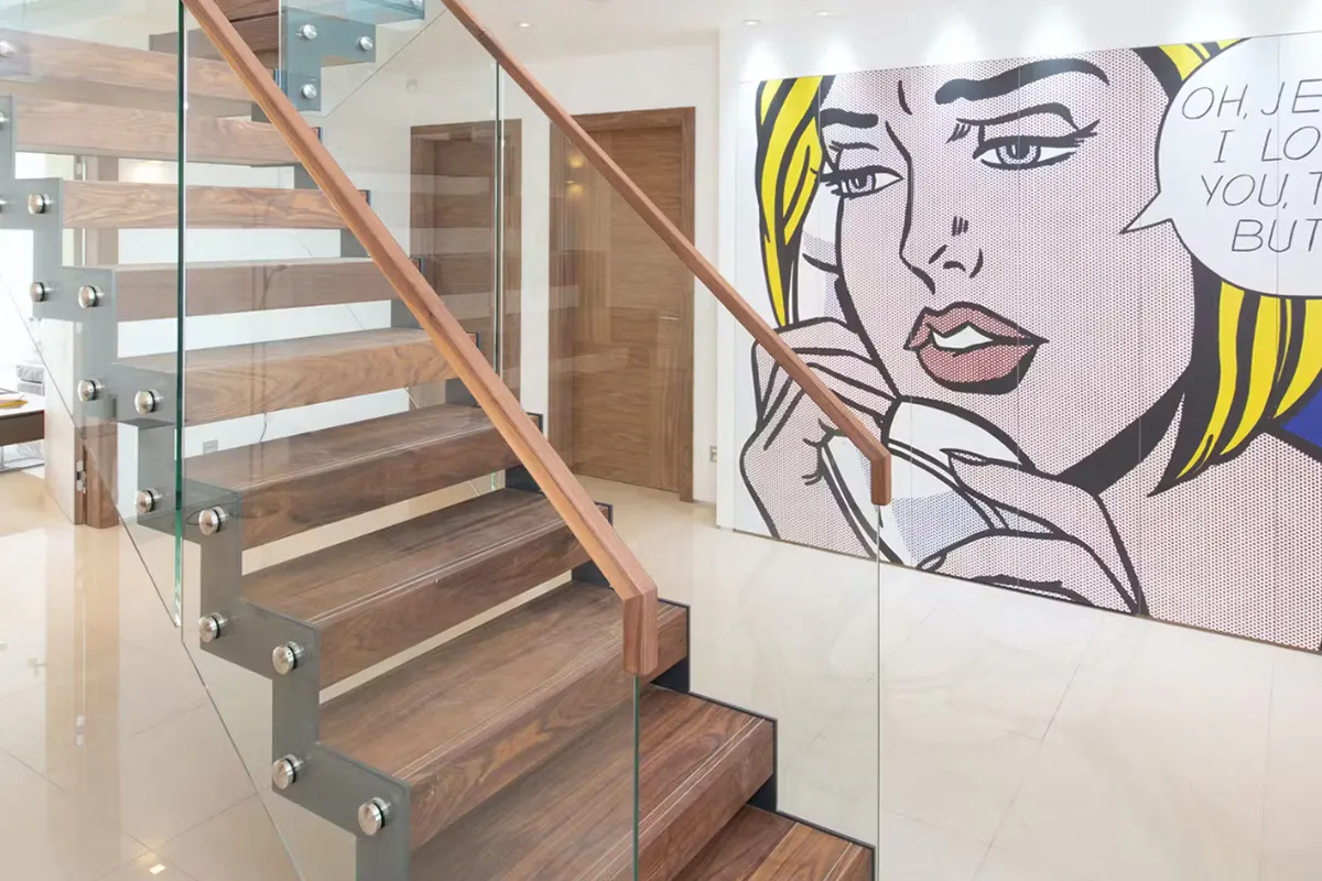 Self-builder's home with a contemporary hallway and staircase with two single door sets - Vario 4 door style in walnut finish by Deuren.