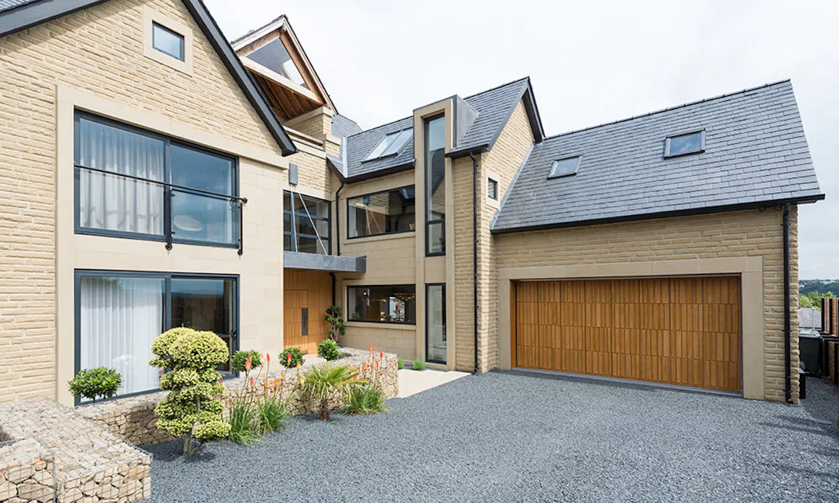 A modern house with matching front and garage doors.