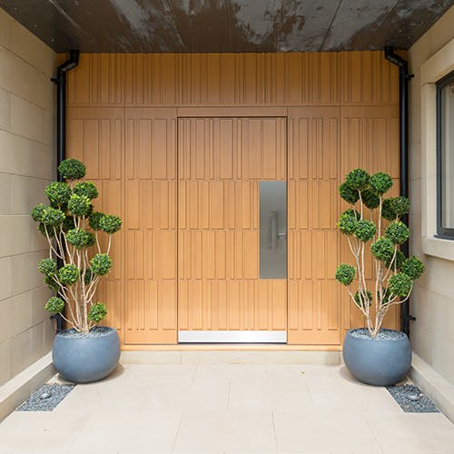 An external entrance with a Tavole S Deuren door