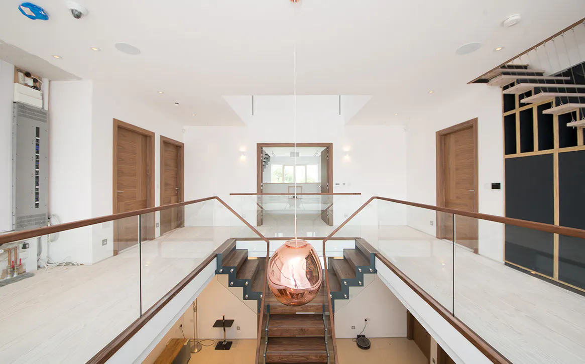 Hall way with matching wooden internal doors and staircase