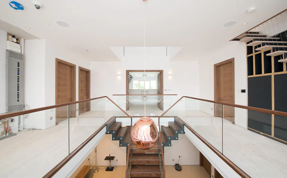 Hall way with matching wooden internal doors and staircase 