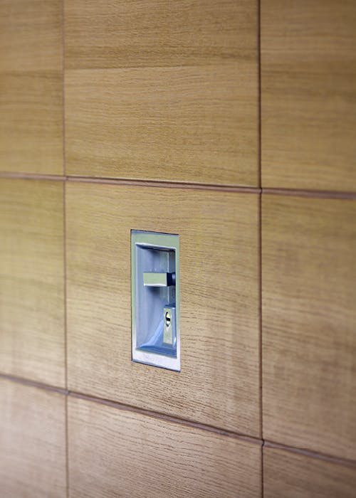 modern wooden garage door with secure modern handle
