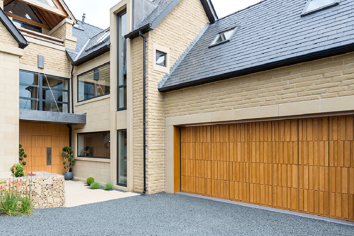 large modern house with matching oak front and garage door