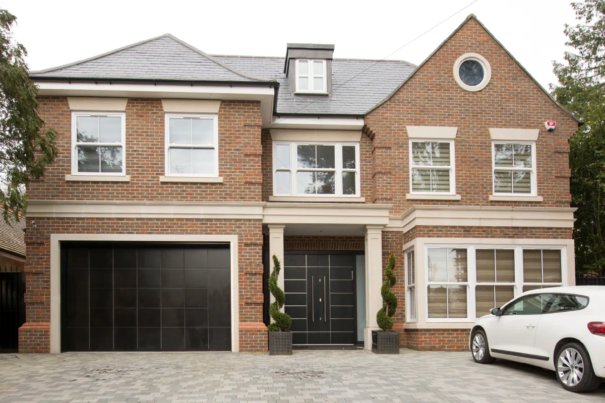 Modern matching black front and garage door