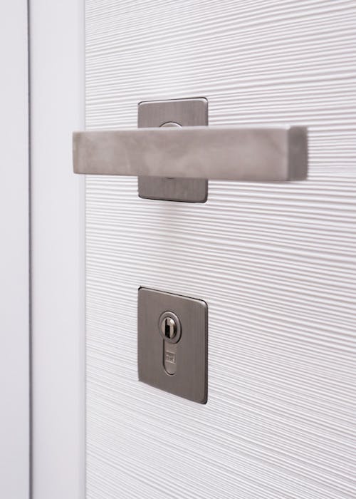 A white door with a chrome handle.