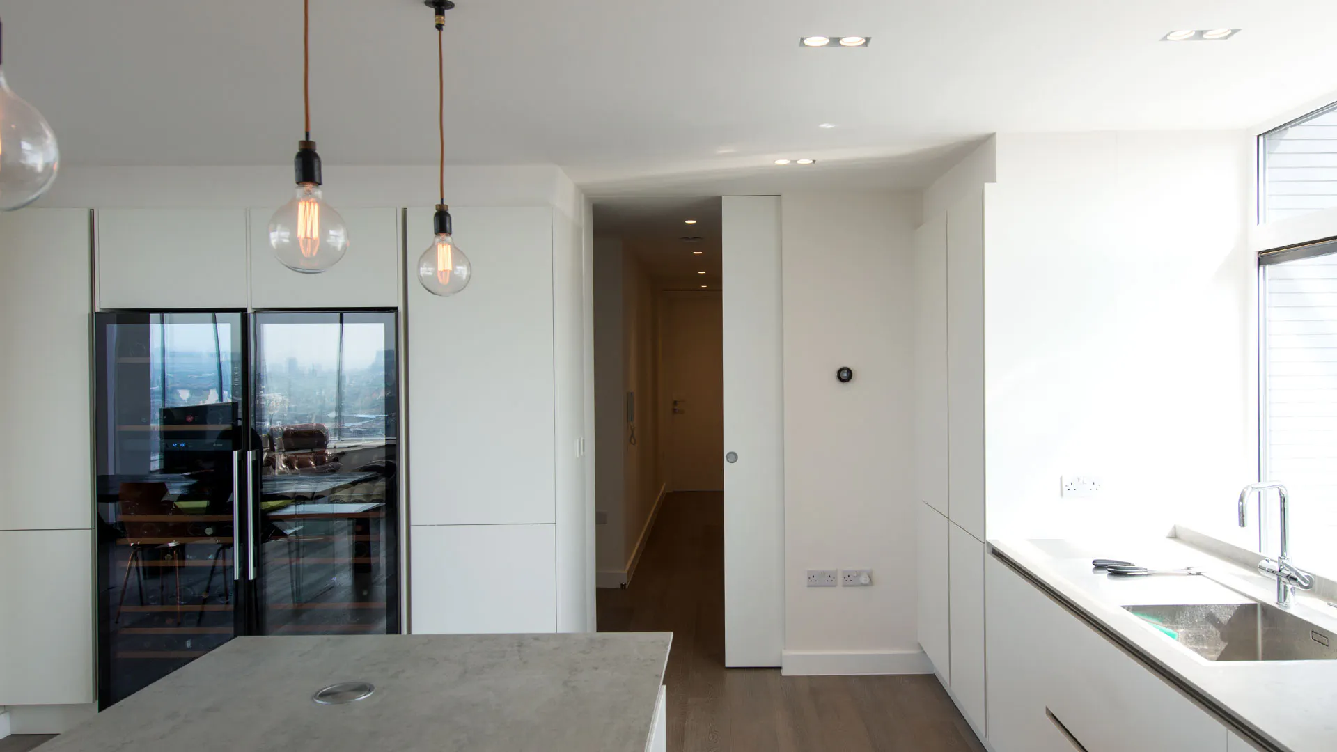 A kitchen with a full height internal door