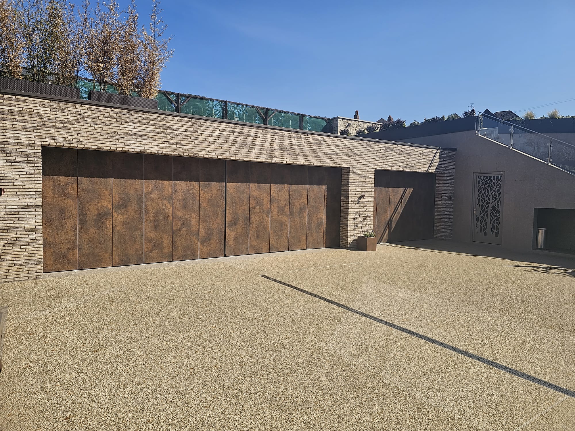 Olivo Garage door | Patina Bronze Special Finish | Side Sectional