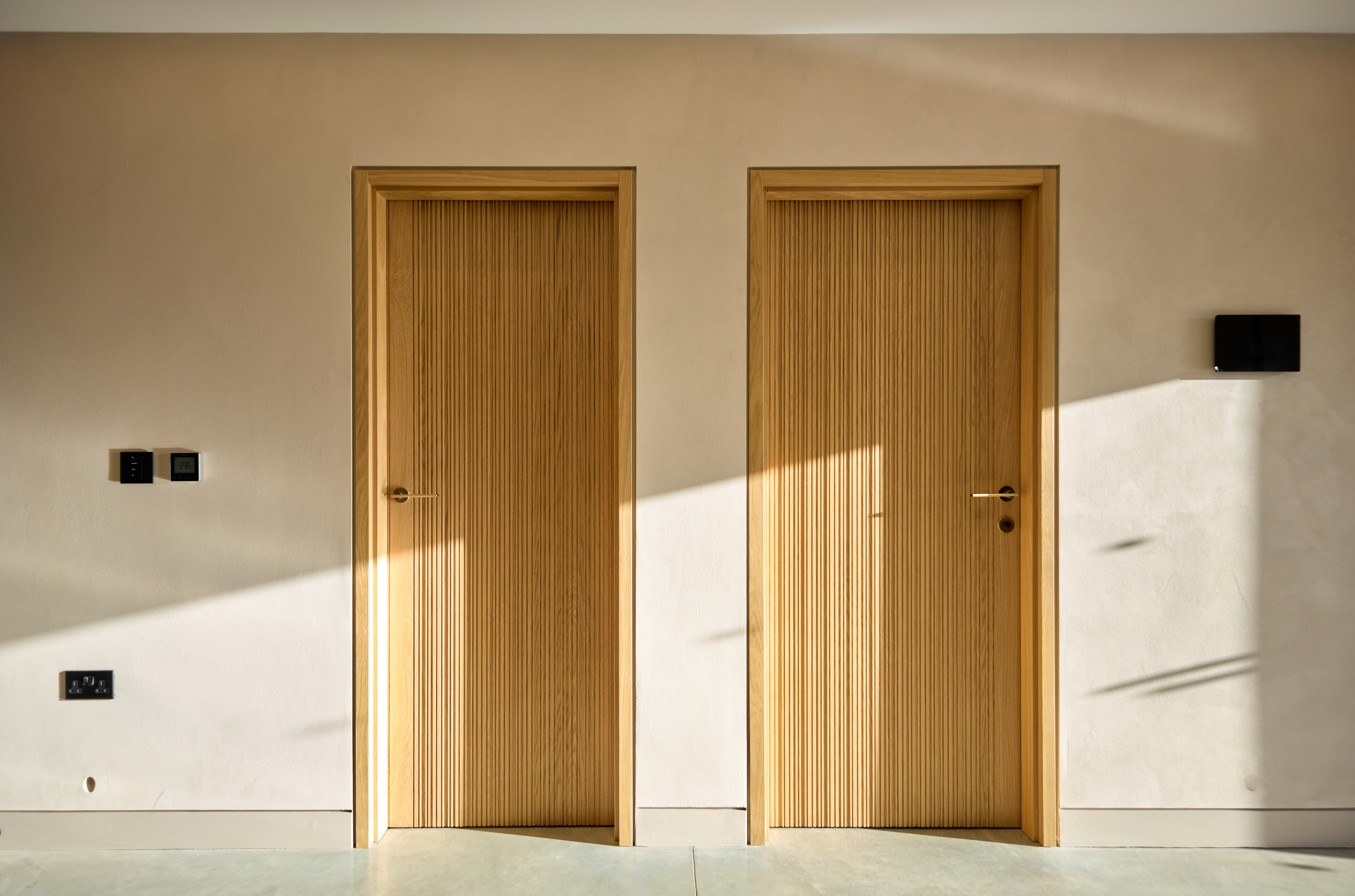 Bespoke internal door with bespoke grooved detailing in natural oak