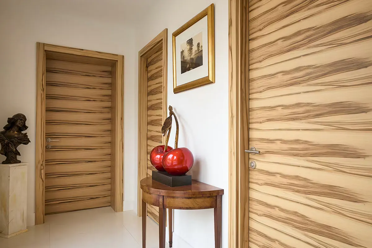 Modern corridor featuring 3 pre-hung door-sets by Deuren - Trem H style in satuin walnut finish.