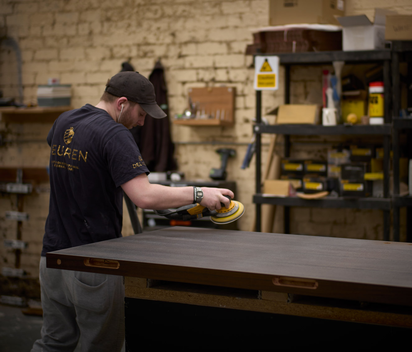 A Deuren door being sanded in the factory