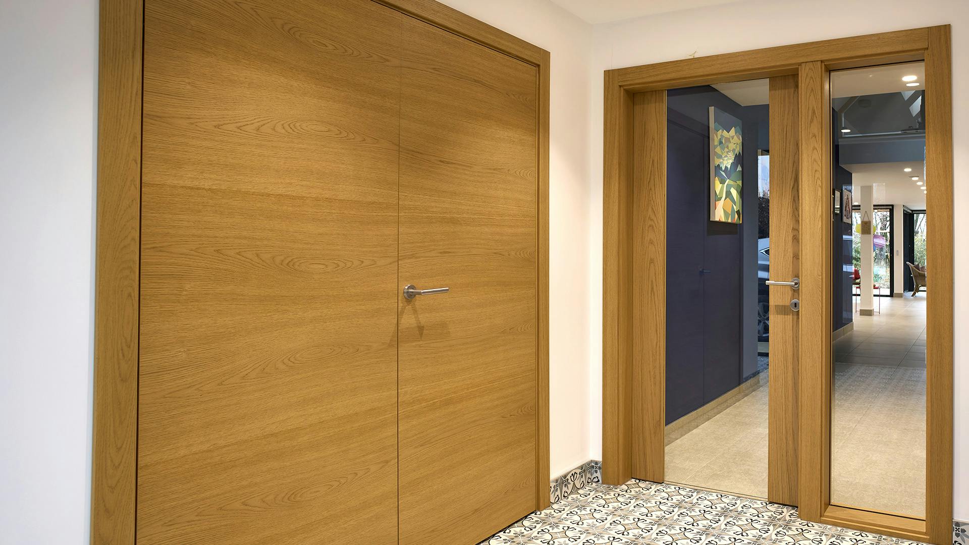 Light wood unglazed and glazed surround internal doors