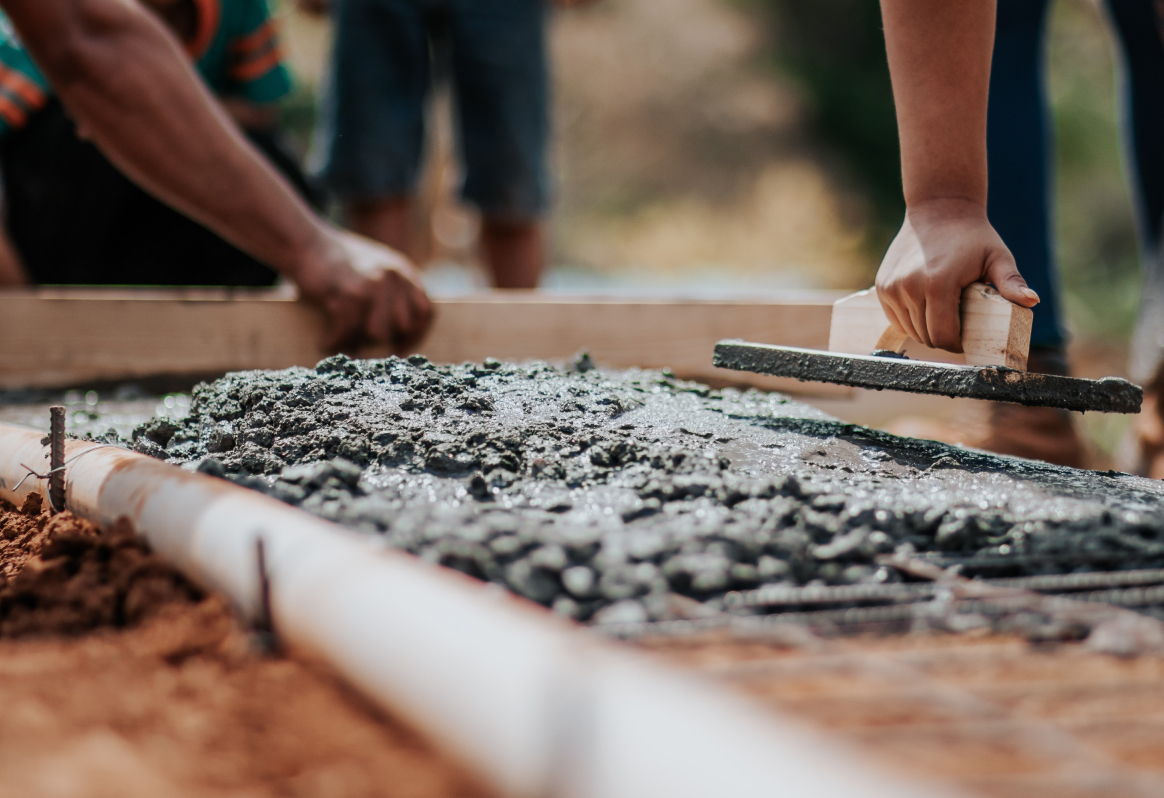 People laying cement