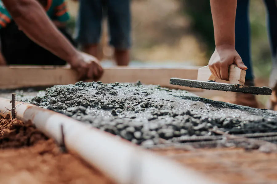 People laying cement