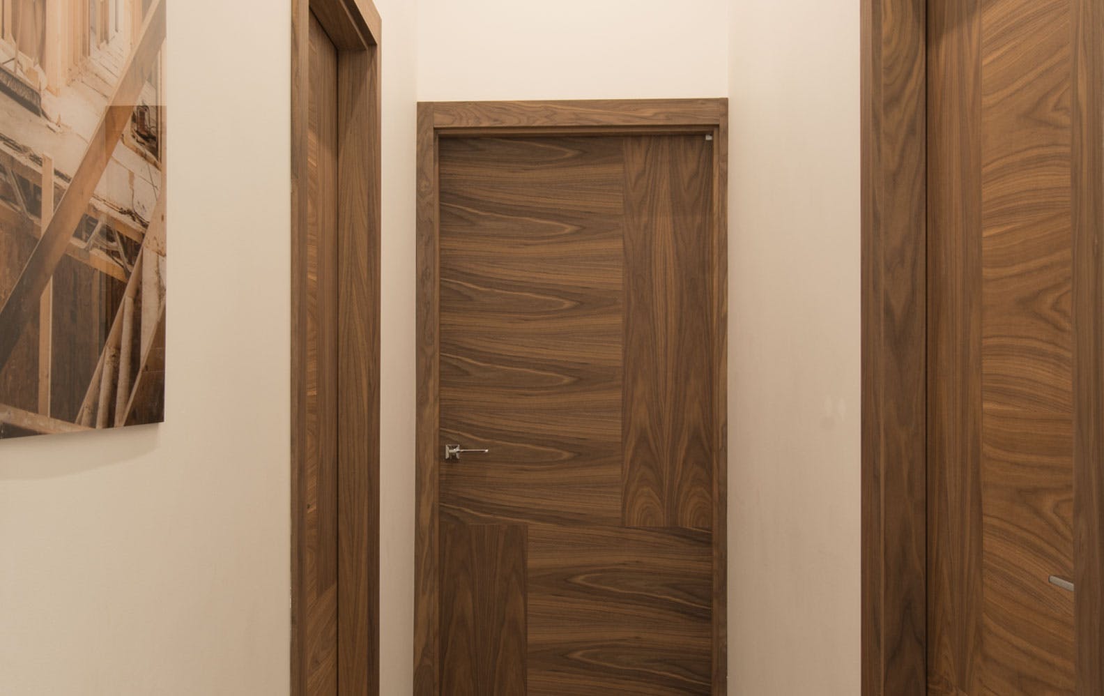 3 different sized, made-to-measure interal door sets by Deuren - Vario 4 style, in a Walnut veneer, oriented in 4 ways.