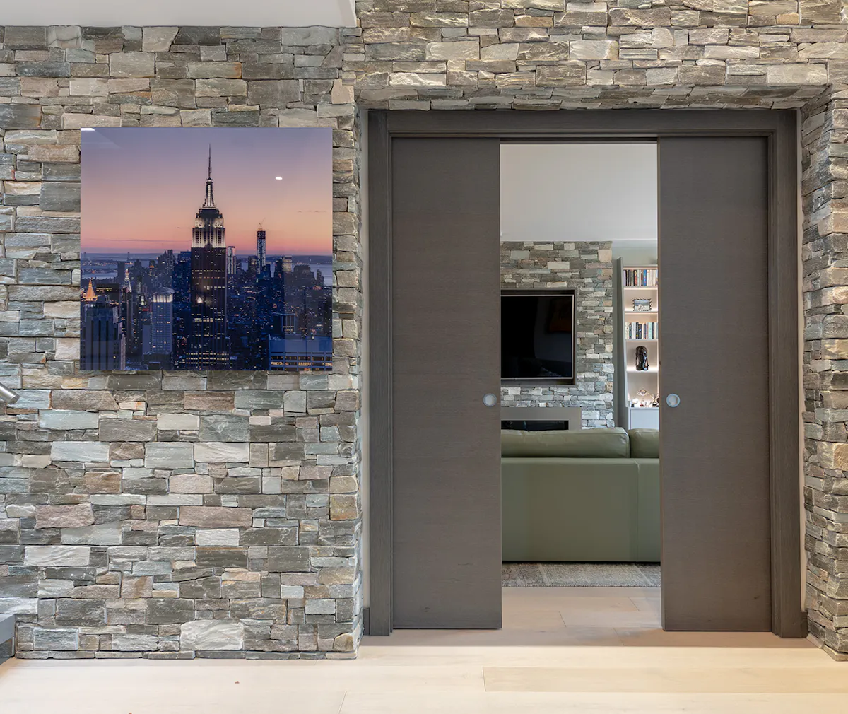 Internal shot of a home with grey internal pocket doors, opened.