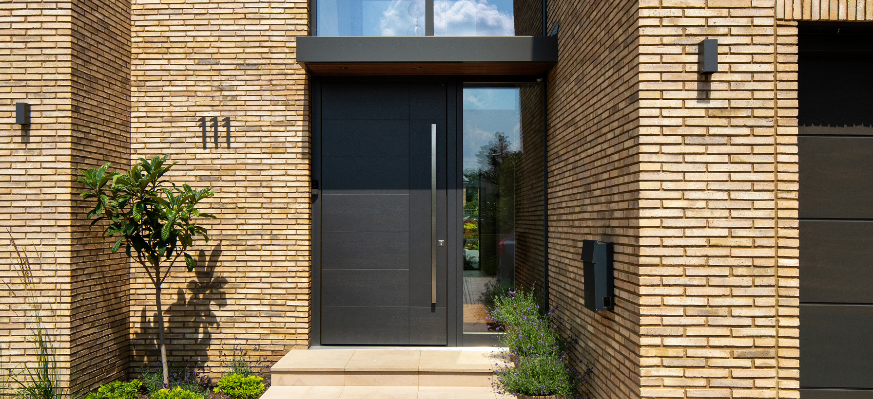 Dark matted textured Olivo SI outside front door