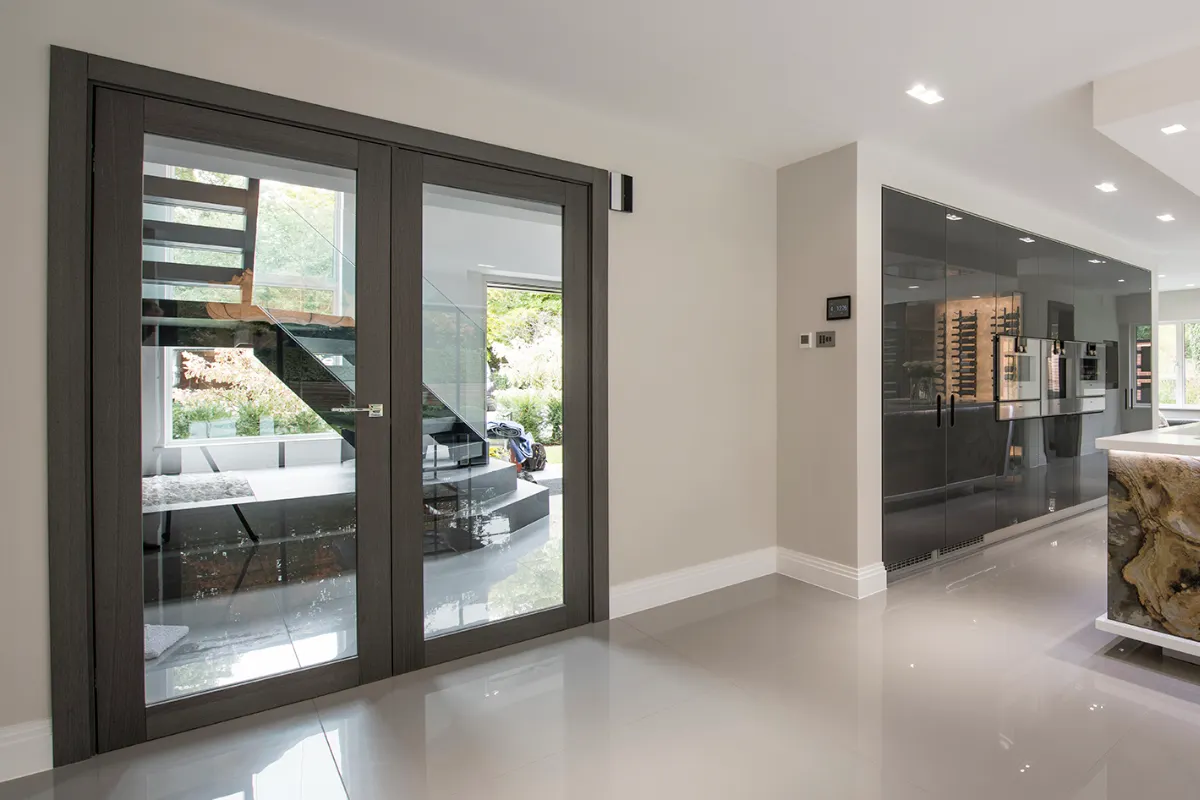 Contemporary glazed double doors featuring Mandelli handles.